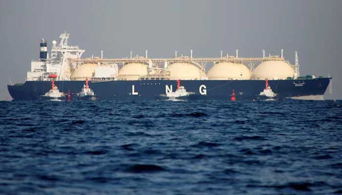 A liquefied natural gas (LNG) tanker is being tugged by boats. — Reuters/File