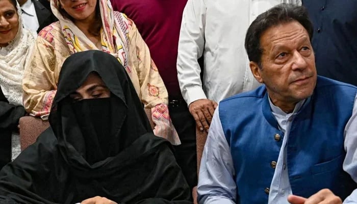 PTI founder Imran Khan (right) and his wife Bushra Bibi. — AFP/File