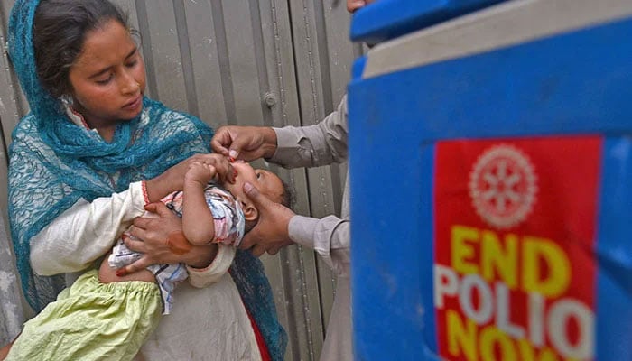 A health worker administers polio vaccine drops to a child. — AFP/File