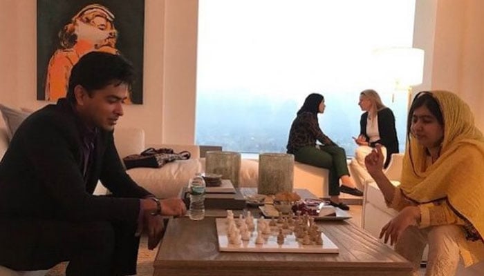 Pop singer and education activist Shehzad Roy plays chess with Malala Yousafzai. — Image by Shehzad Roy
