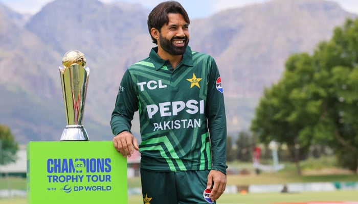Pakistans white-ball captain Mohammad Rizwan posing with the trophy of the ICC Champions Trophy 2025 on December 17, 2024. — AFP
