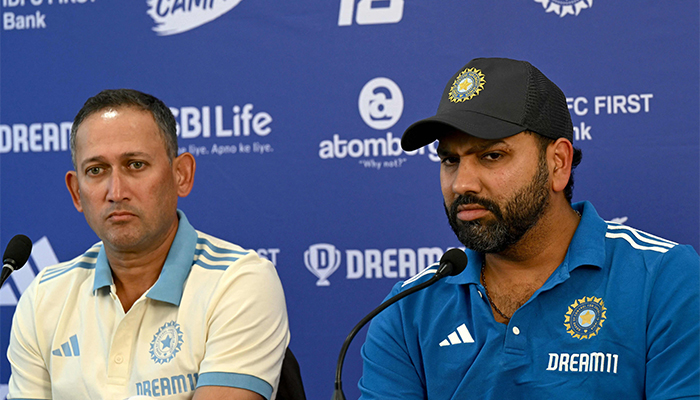 Indian cricket captain Rohit Sharma (R) and Ajit Agarkar current chairman of the BCCI selection committee, address a press conference in Mumbai on January 18, 2025. — AFP