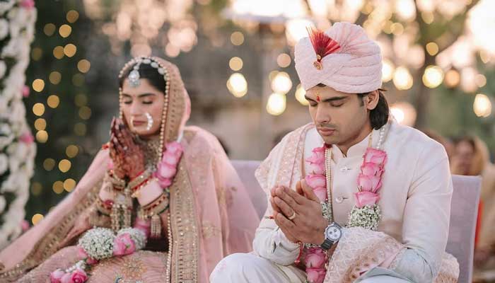 Neeraj Chopra and Himani Mor gesture during their wedding ceremony. — Instagram@neeraj____chopra