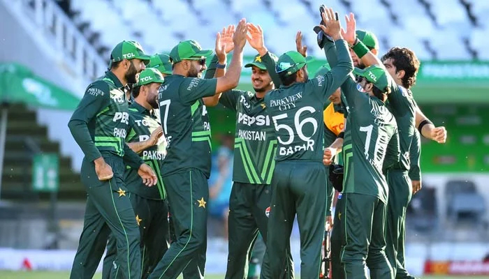 Pakistan team celebrating their victory against South Africa. — AFP