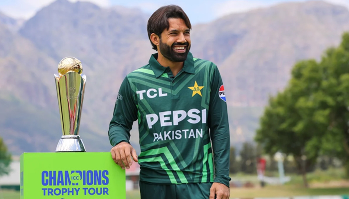 Pakistans white-ball captain Mohammad Rizwan posing with the trophy of the ICC Mens Champions Trophy 2025 during the trophy tour in South Africas town of Paarl on December 17, 2024. — AFP