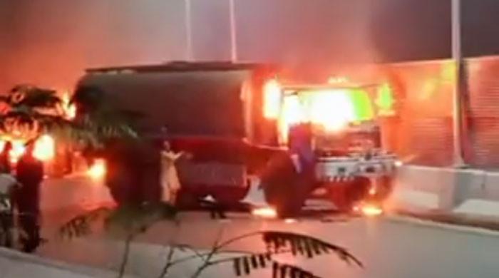 Five trucks torched after reckless heavy vehicle race claims another life in Karachi