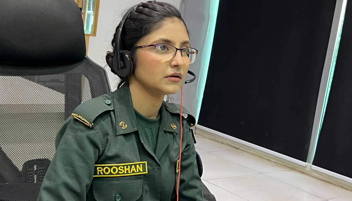 Roshaan Laghari, a young emergency medical dispatcher at the Sindh Rescue Service, is working at her station in command-and-control room. — Author