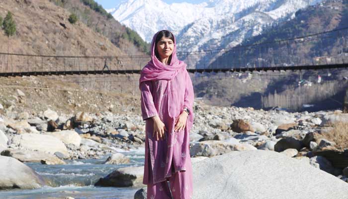 Nobel Peace Prize laureate and education activist Malala Yousafzai poses for a picture at riverside in her home village Barkana, Shangla district, Khyber Pakhtunkhwa, March 5, 2025. — X/@Malala