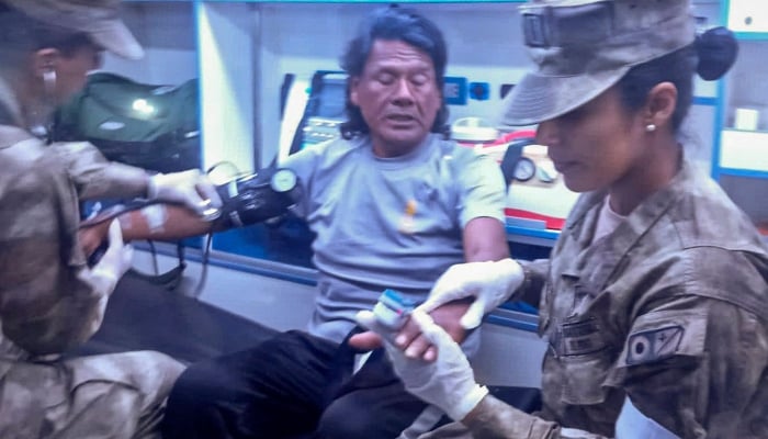 This handout picture released on March 15, 2025, by the Peruvian Navy shows Peruvian fisherman Maximo Napa, 61, receiving medical attention upon his arrival in Paita, Piura department, Peru. — AFP
