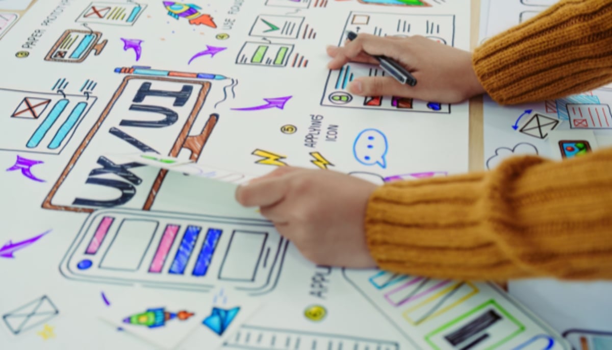 A representational image of a graphic designer at work. — Canva