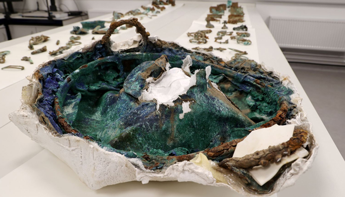 Harness pieces decorated with Mediterranean coral and coloured glass found in hoard. — Durham University/File