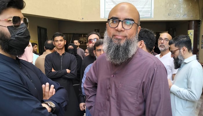 Journalist Farhan Mallick gestures as he appears before the court of a judicial magistrate in Karachi, on March 31, 2025. — Facebook@MJibranNasir