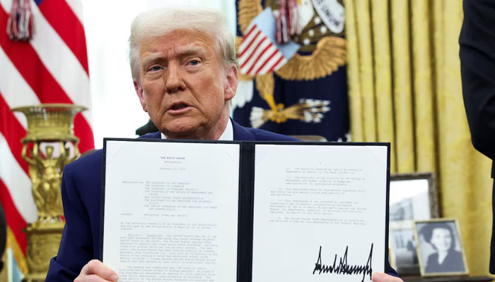 US President Donald Trump holds an executive order about tariffs increase in the Oval Office of the White House in Washington, US, February 13, 2025. — Reuters