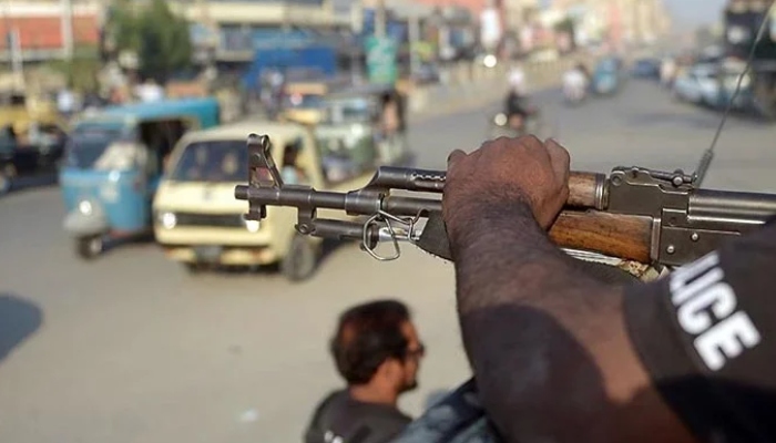 A policeman stands guard on a street in Karachi in this undated photo. — AFP/File