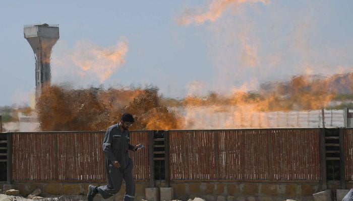 Smoke and flames rise from a fire in Karachis Korangi area on March 29,2025. — Online