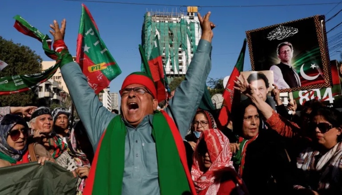 Supporters of PTI protest outside the provincial election commission office in Karachi on February 17, 2024. — Reuters