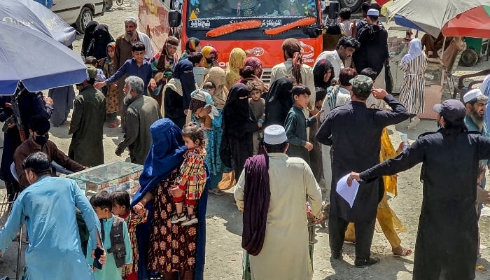 Afghan refugees arrive to undergo biometric verifications at National Database and Registration Authority (Nadra) ahead of their departure for Afghanistan, at a holding centre in Landi Kotal on April 7, 2025. — AFP