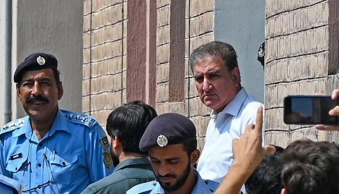 PTI leader Shah Mahmood Qureshi is seen outside a special court after he was granted a four-day physical remand in Islamabad on August 21, 2023. — AFP
