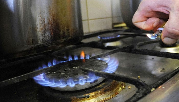 A person can be seen lighting a stove. — AFP/File