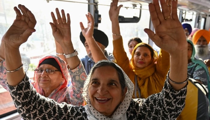 Sikh pilgrims gesture from inside a bus before leaving for Pakistan during Baisakhi, a spring harvest festival, in Amritsar, India, on April 10, 2025. — AFP