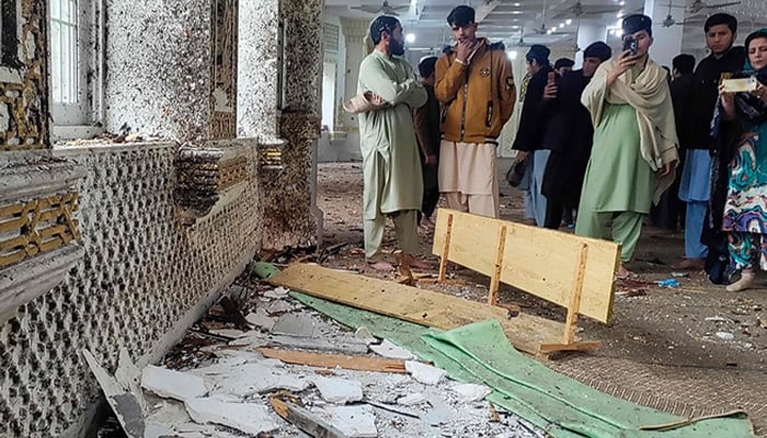People gathers inside Dar-ul-Uloom Haqqania following a terrorist attack in Akora Khattak, Khyber Pakhtunkhwa. — AFP/File