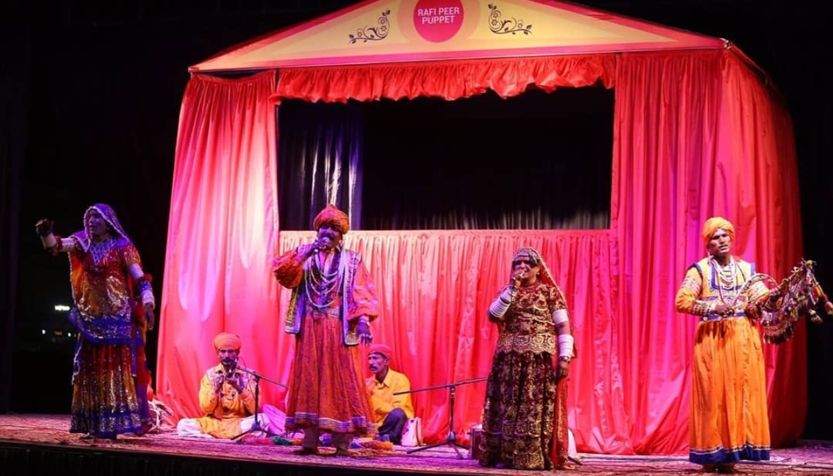 This photograph shows a performance by a folk music group at the Rafi Peer Theatre. — Instagram/@rafipeertheatre