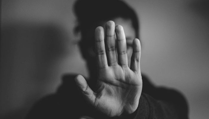 A representational image of a person protesting against violence against women. — Unsplash/File