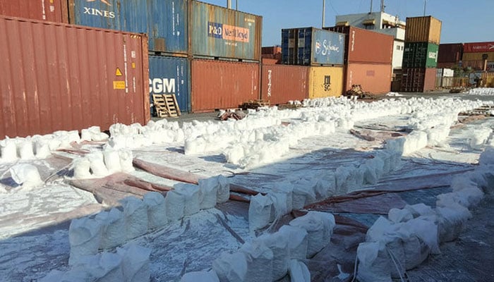This handout photo, taken and released by ANF shows seized bags of soapstone containing Methamphetamine drug substance exported from Afghanistan to Belgium at the Karachi port in Karachi on May 2, 2024. — ANF