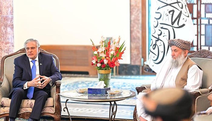 DPM Dar pictured with Afghan interim Prime Minister Mullah Muhammad Hassan Akhund. — MOFA