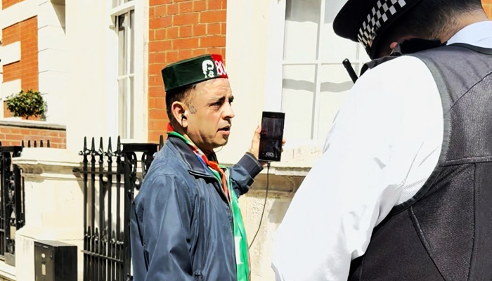 PTI supporter TikToker Gulfam Hussain during an interaction with police personnel in London in this file image. — Reporter