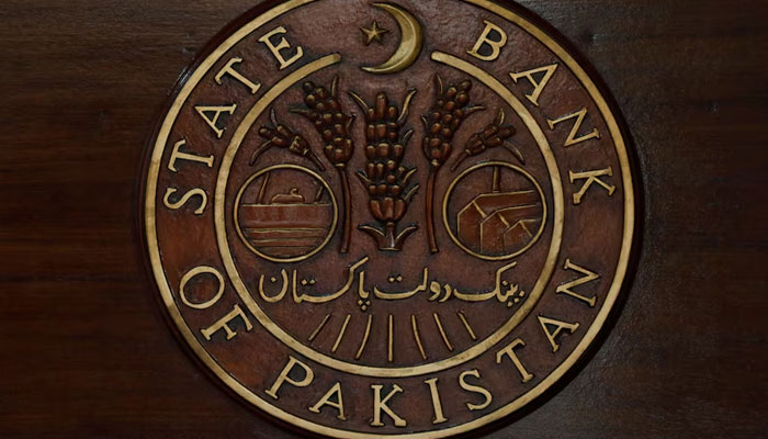 The logo of the State Bank of Pakistan is pictured on a reception desk at the banks head office in Karachi. — Reutrs/File