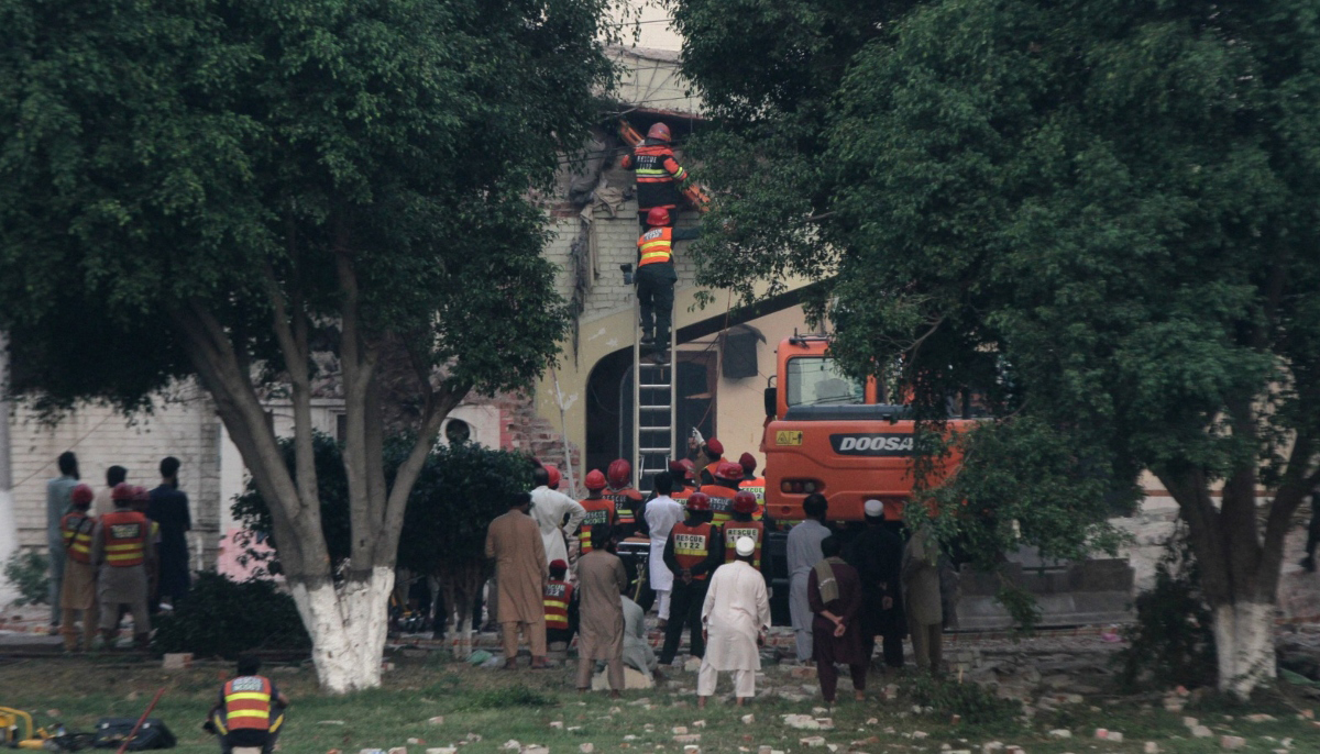 Rescuers search for survivors in a damaged building after it was hit by an Indian strike in Muridke near Lahore, May 7, 2025. — Reuters