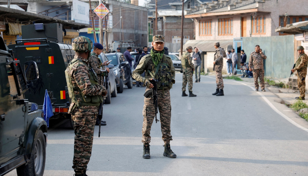 Indian security force personnel stand guard near the site of a fighter jet crash in Wuyan in IIOJKs Pulwama district May 7, 2025. — Reuters