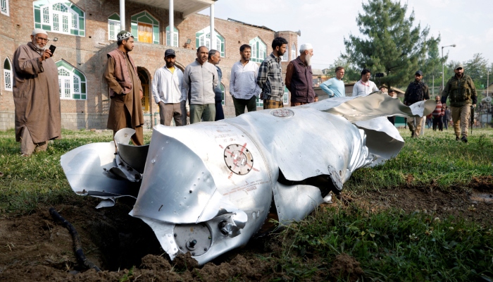 Metal debris lies on the ground in Wuyan in IIOJKs Pulwama district May 7, 2025. — Reuters