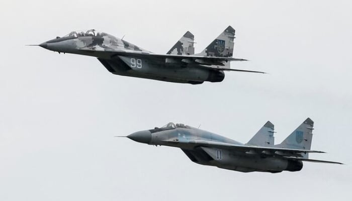 MIG-29 fighter aircrafts fly at a military air base in Vasylkiv, Ukraine, August 3, 2016. — Reuters