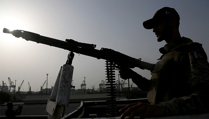 A paramilitary trooper mans a gun atop a vehicle as he keeps guard during a media tour of the Karachi Port, Pakistan, May 9, 2025. — Reuters