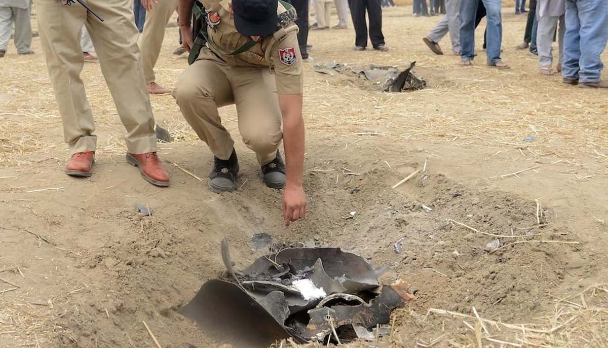 Police officers inspect metal debris, amid hostilities between Pakistan and India, in a field on the outskirts of Jalandhar, India, May 10, 2025. — Reuter