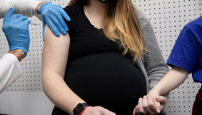 A pregnant woman receives a vaccine at Skippack Pharmacy in Schwenksville, Pennsylvania, US, February 11, 2021. — Reuters