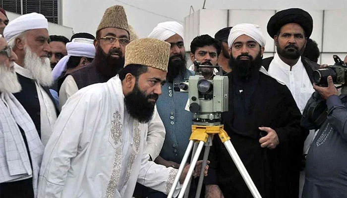 Central Ruet-e-Hilal Committee Chairman Maulana Abdul Khabir Azad sighting the moon from the rooftop of Auqaf Hall, Peshawar in this undated image. — APP/File