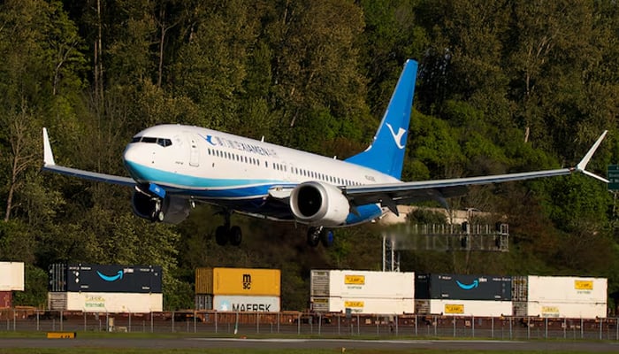 A Boeing 737 MAX 8, the second jet intended for use by a Chinese airline to be returned to its manufacturer, lands at Boeing Field, as trade tensions escalate over US tariffs with China, in Seattle, Washington, US April 22, 2025. — Reuters