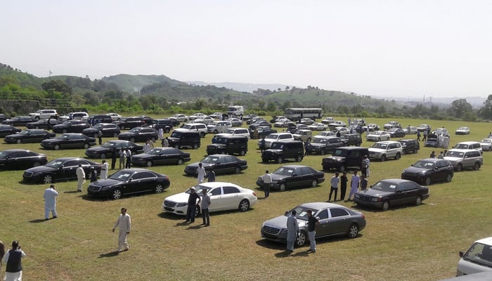People visit an auction of government owned used cars at the premises of Prime Minister House in Islamabad, September 17, 2018. — Reuters