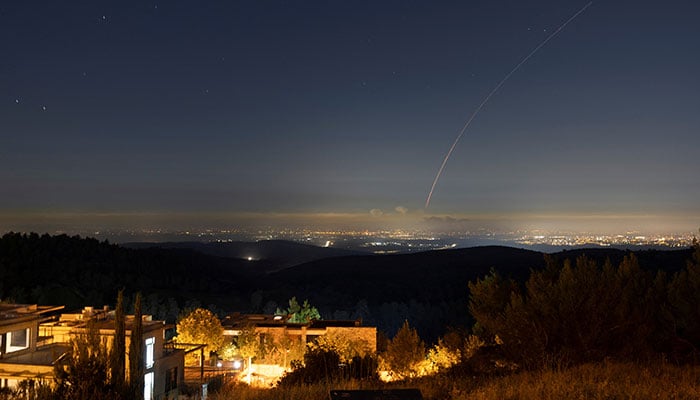 Missiles launched from Iran towards Israel are intercepted, as seen from Gedera, Israel June 14, 2025. — Reuters