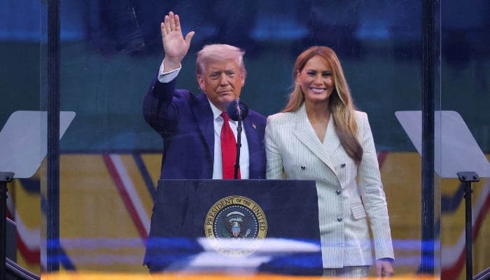 US President Donald Trump waves next to first lady Melania Trump following the military parade to commemorate the US Armys 250th Birthday, on the day of Trumps 79th birthday, in Washington, DC, US, on June 14, 2025. — Reuters