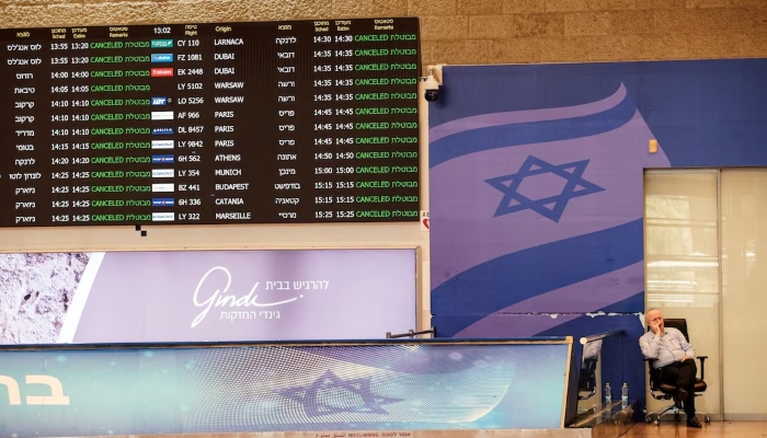 A staff of Ben Gurion International Airport, sits at the arrivals terminal as all flights from and to the airport are indicated cancel, following an overnight Israeli attack on Iran, in Lod near Tel Aviv, Israel June 13, 2025. — Reuters