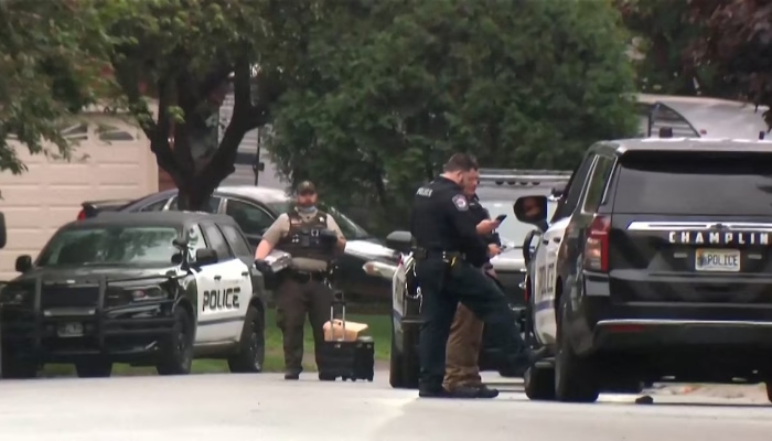 Police stand at a crime scene as they searched for a suspect posing as a police officer who shot two Democratic state lawmakers and their spouses in their homes, in the Minneapolis suburb of Champlin, Minnesota, US June 14, 2025. — Reuters
