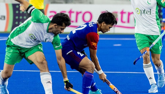 Pakistani Hockey player (in green) is trying to snatch ball from Malaysian player in FIH Nations Cup, June 15, 2025.  — Pakistan Hockey Federation