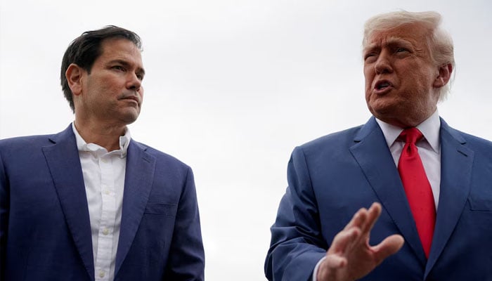 US President Donald Trump stands with US Secretary of State Marco Rubio as he prepares to depart for Hagerstown, Maryland, at Morristown Municipal Airport in Morristown, New Jersey, US, June 8, 2025. — Reuters