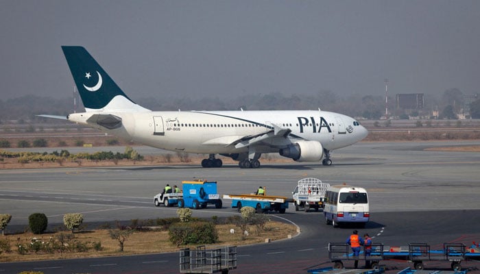 A Pakistan International Airlines (PIA) plane prepares to take-off at Alama Iqbal International Airport in Lahore. — Reuters