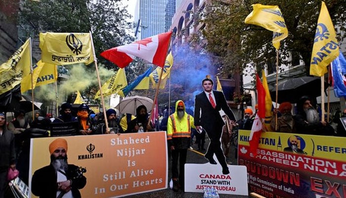 Flags and signs are seen as demonstrators protest outside Indias consulate, a week after Canadas Prime Minister Justin Trudeau raised the prospect of New Delhis involvement in the murder of Sikh separatist leader Hardeep Singh Nijjar, in Vancouver, British Columbia, Canada September 25, 2023. — Reuters