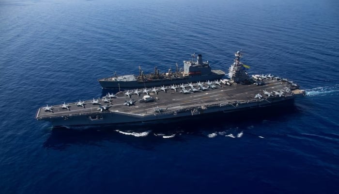 The worlds largest aircraft carrier USS Gerald R Ford steams alongside USNS Laramie (T-AO-203) during a fueling-at-sea in the eastern Mediterranean Sea, in this photo taken on October, 11, 2023. — Reuters